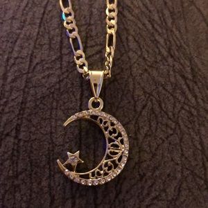 laminated gold chain with moon and star pendant the star.  it is.  small